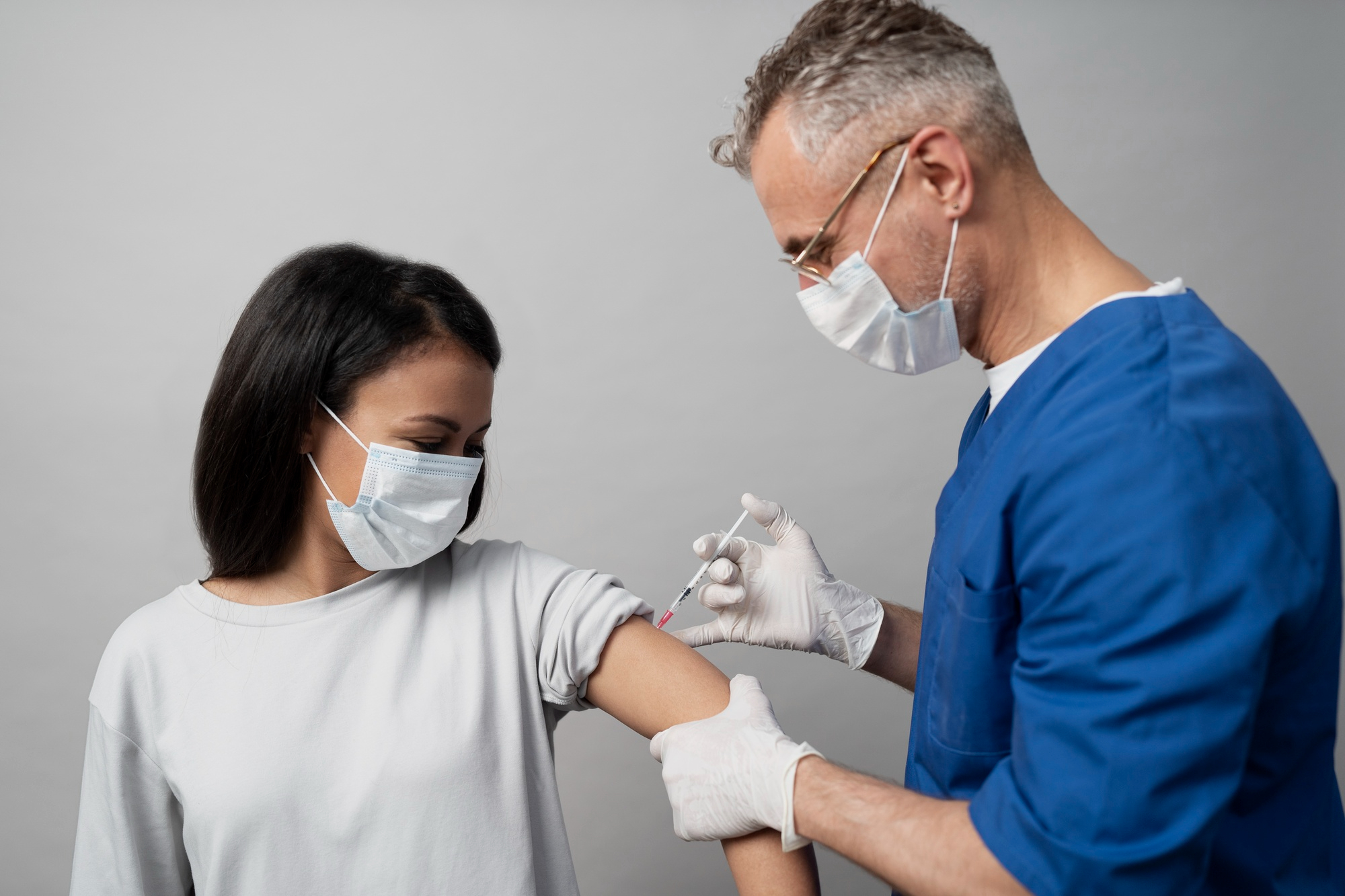 Doctor administering an injection to a patient for anxiety treatment, illustrating the process of securing prior authorization for medications like Dicipam with WellCare Medicare.