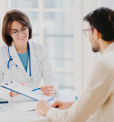 Doctor consulting with a patient about the prior authorization process for Oxycodone to manage chronic pain.