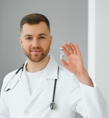 Doctor holding a vial of Cyanocobalamin, commonly used for treating vitamin B12 deficiency anemia