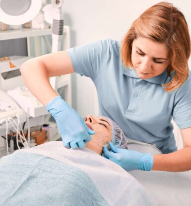 Healthcare professional performing a treatment on a patient in a clinical setting for prior authorization purposes.