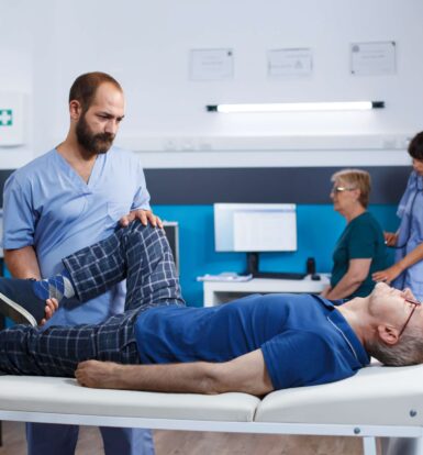 Physical therapist assisting a patient with neuralgia in a clinical setting, representing the process of prior authorization for Horizant.