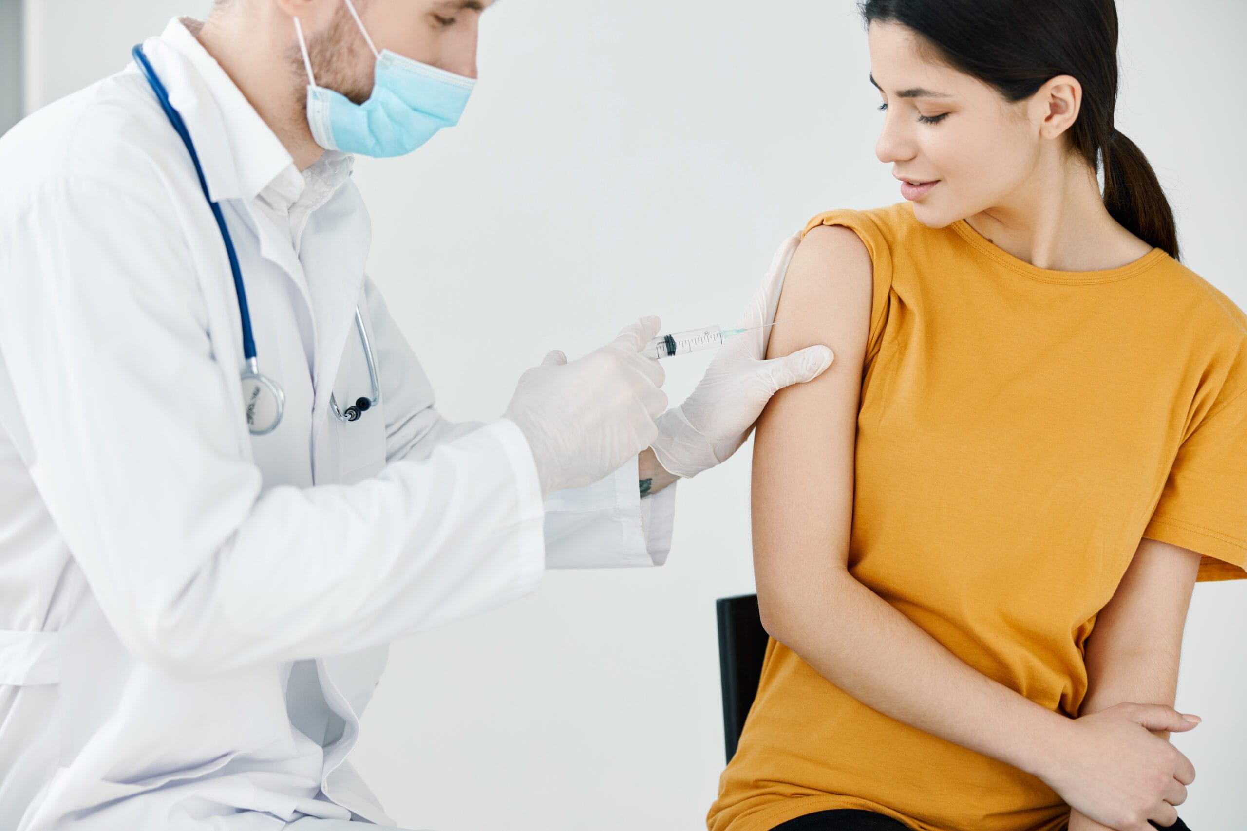 Doctor administering an injection to a patient, symbolizing diabetes management with injectable medications like Ozempic