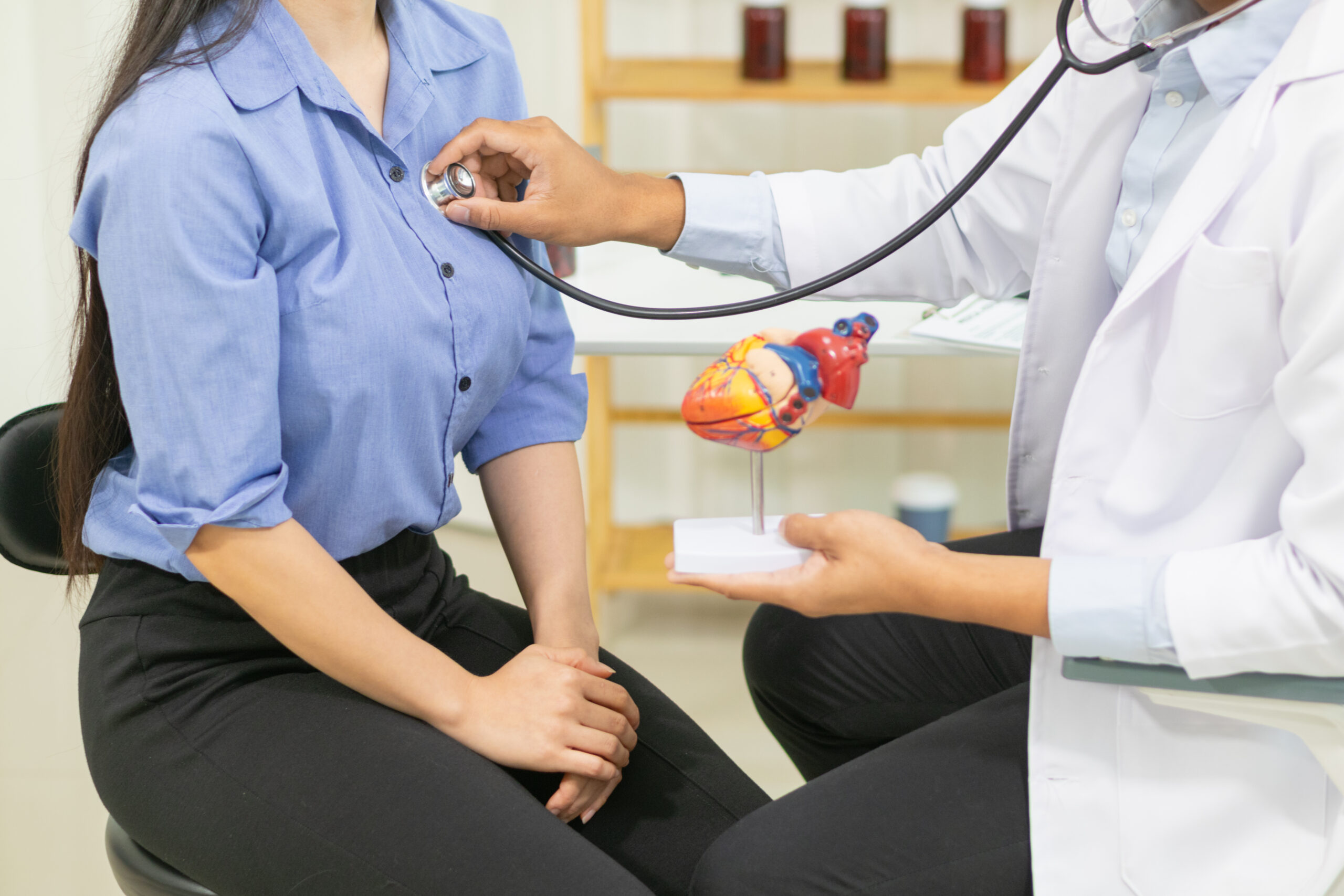 Doctor using a stethoscope to check a patient's heart, symbolizing care for hypertension management with Metoprolol Tartrate