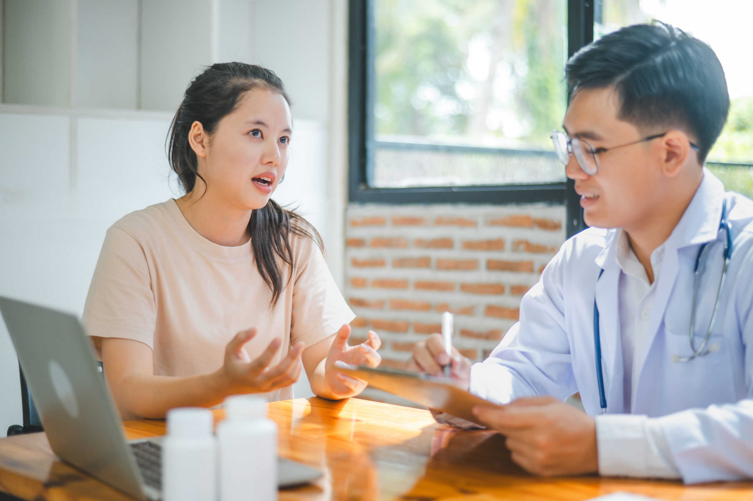 Patient consulting with a doctor about prior authorization for Sodium Tasobactam, a high-cost antibiotic, to treat a complex infection.