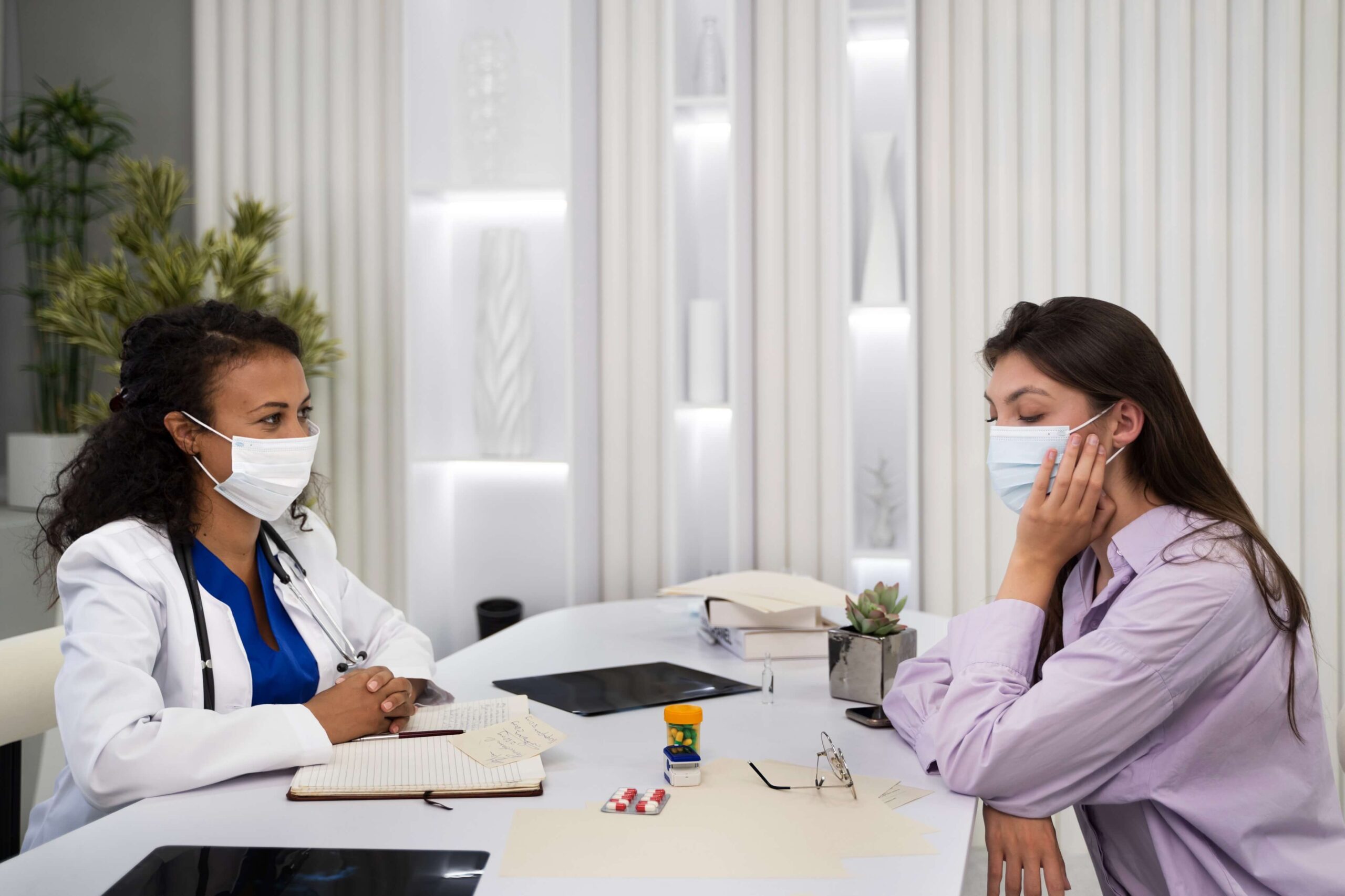 Healthcare provider consulting with a patient on medication management for anxiety in a clinical setting.