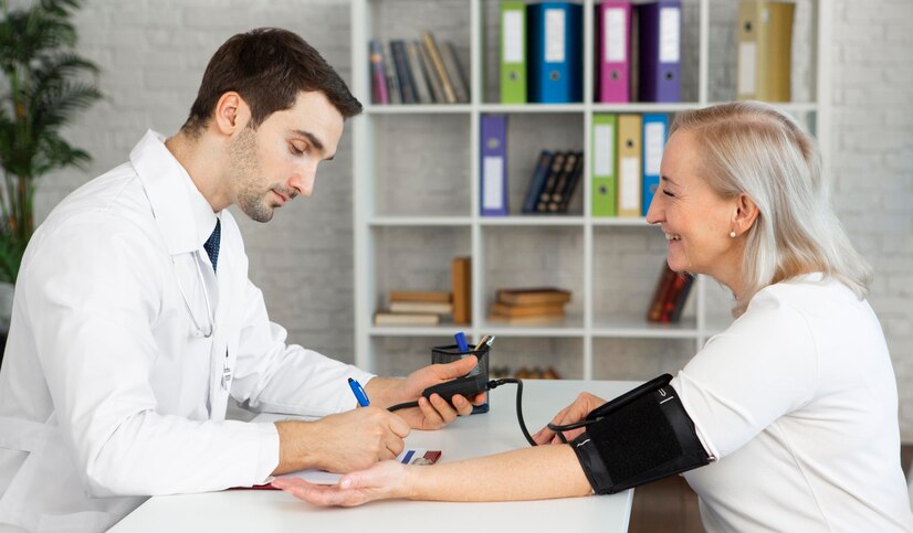 Doctor taking patient’s blood pressure while discussing prior authorization for Insulin Lispro with Optum.