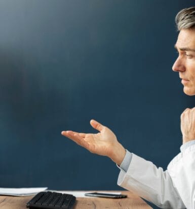 Doctor conducting a virtual consultation on a computer screen, illustrating the role of virtual medical assistants in healthcare.