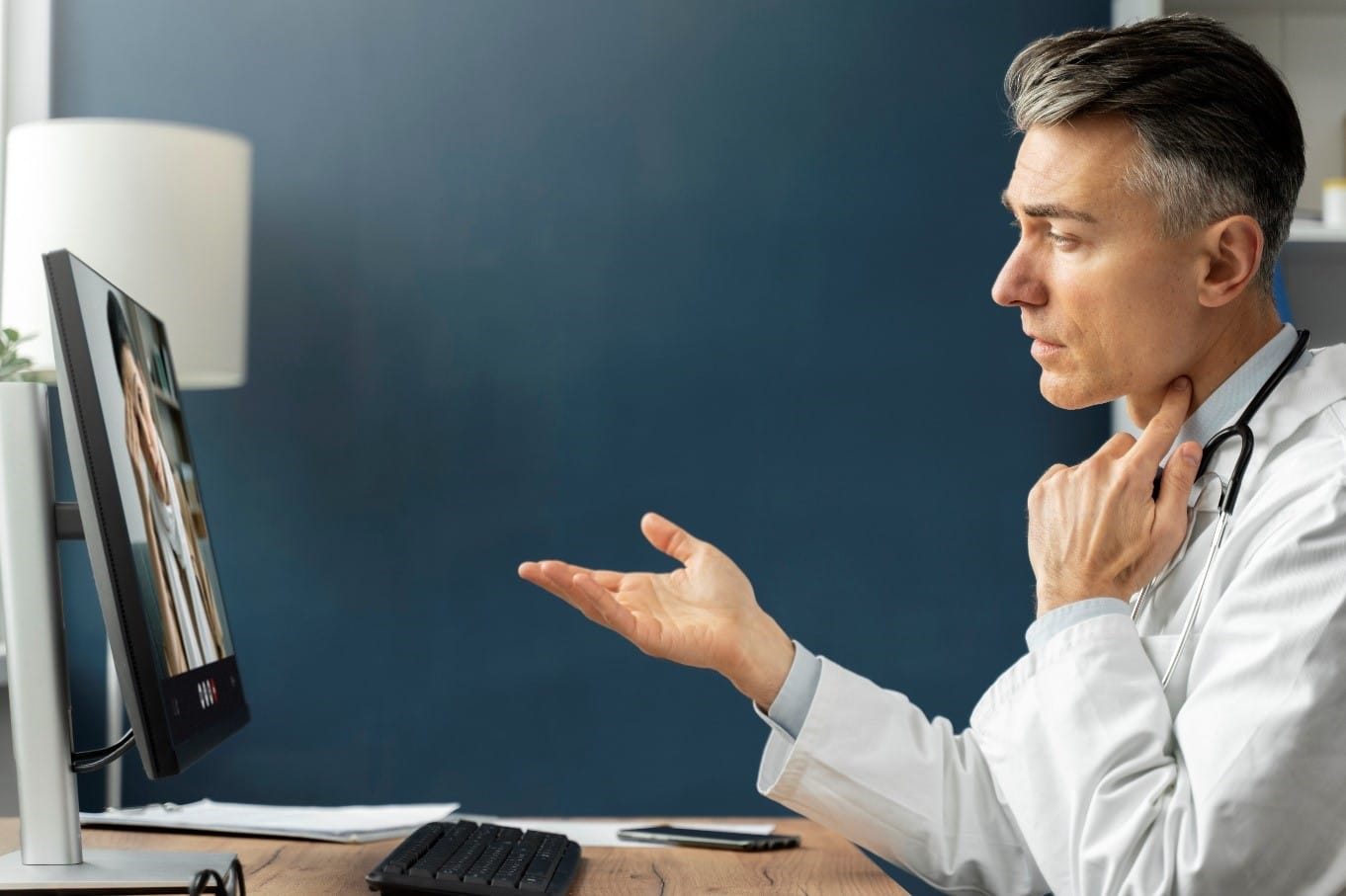 Doctor conducting a virtual consultation on a computer screen, illustrating the role of virtual medical assistants in healthcare.