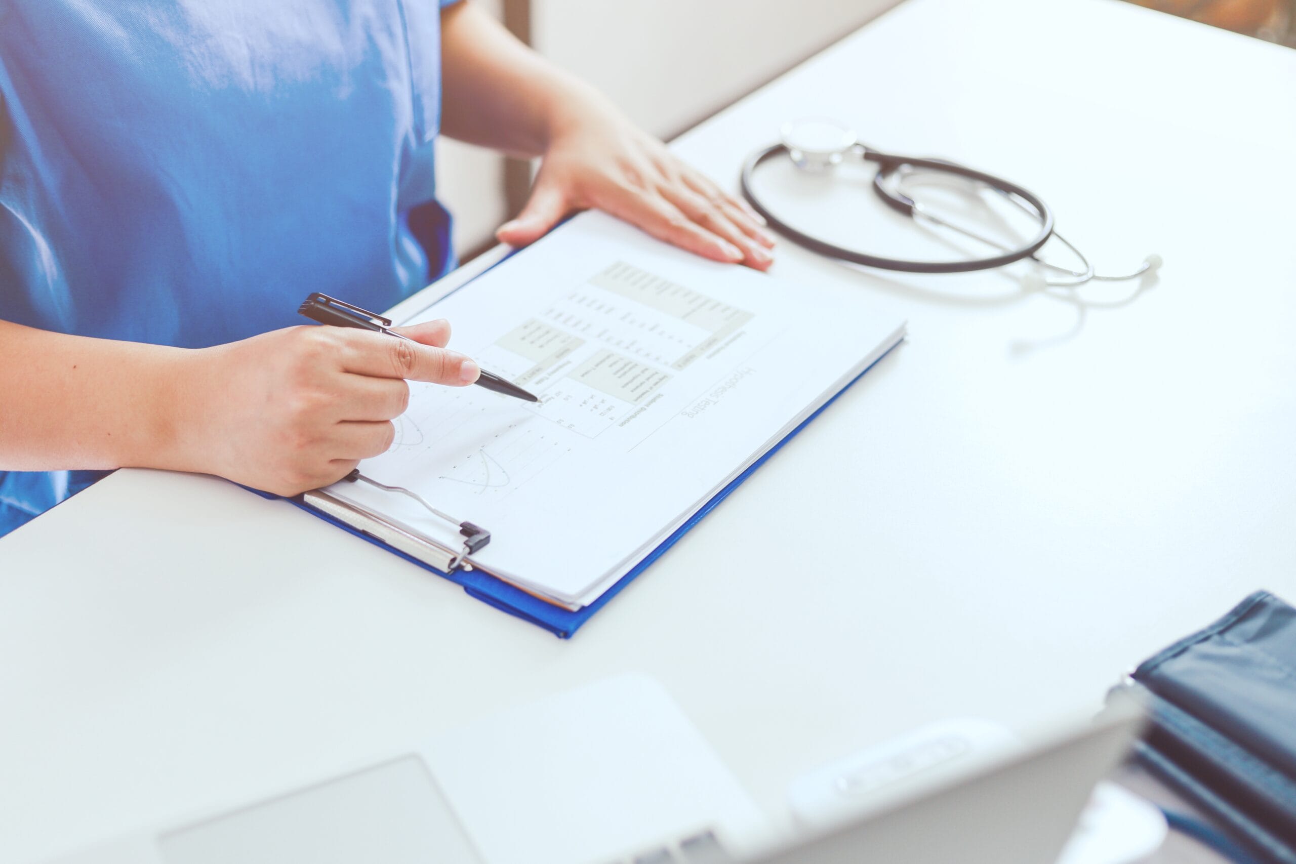 A medical coder working securely on patient data, ensuring HIPAA compliance.