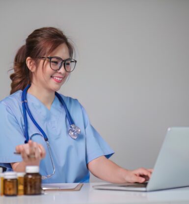 A female doctor in a white coat using a laptop while taking notes, with medical icons and digital health graphics in the background, representing the use of eClinicalWorks (eCW) for contact management.