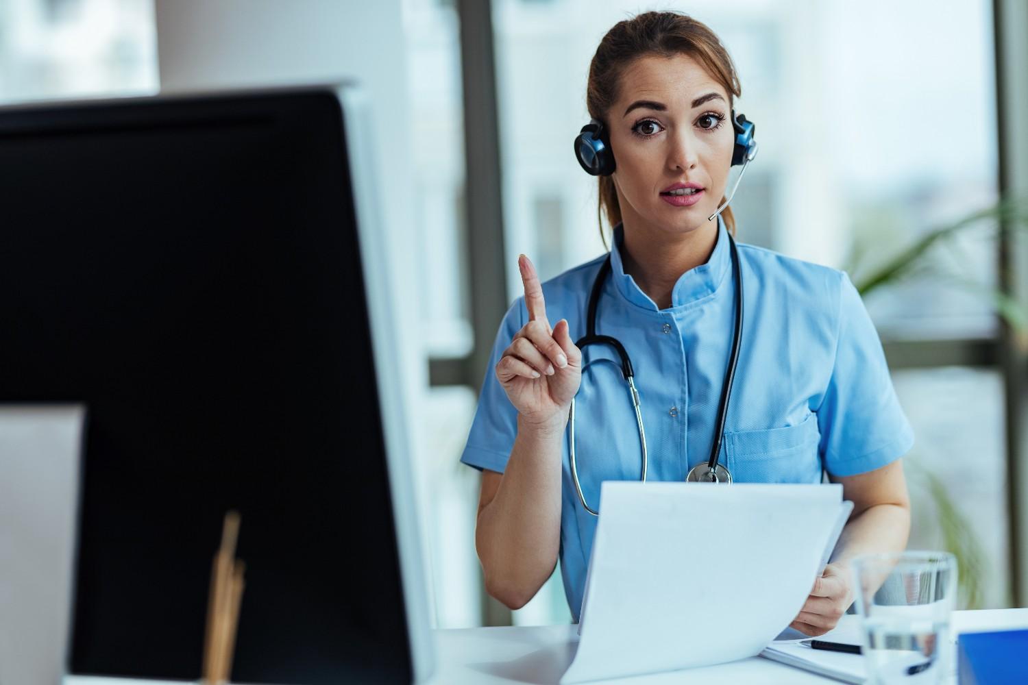 A virtual medical receptionist wearing a headset and holding paperwork, providing professional remote assistance to a healthcare practice.