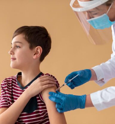 Healthcare provider administering an injection to a young patient as part of growth hormone therapy.