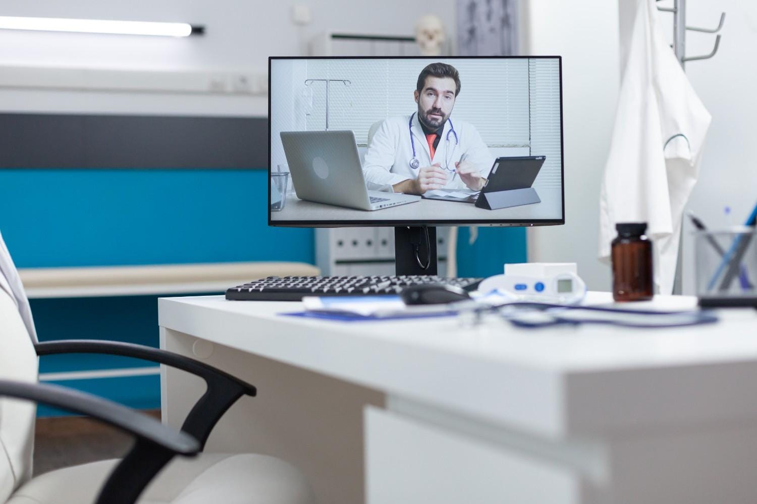 A doctor conducting a telemedicine consultation on a computer screen, highlighting virtual medical assistance in remote healthcare.