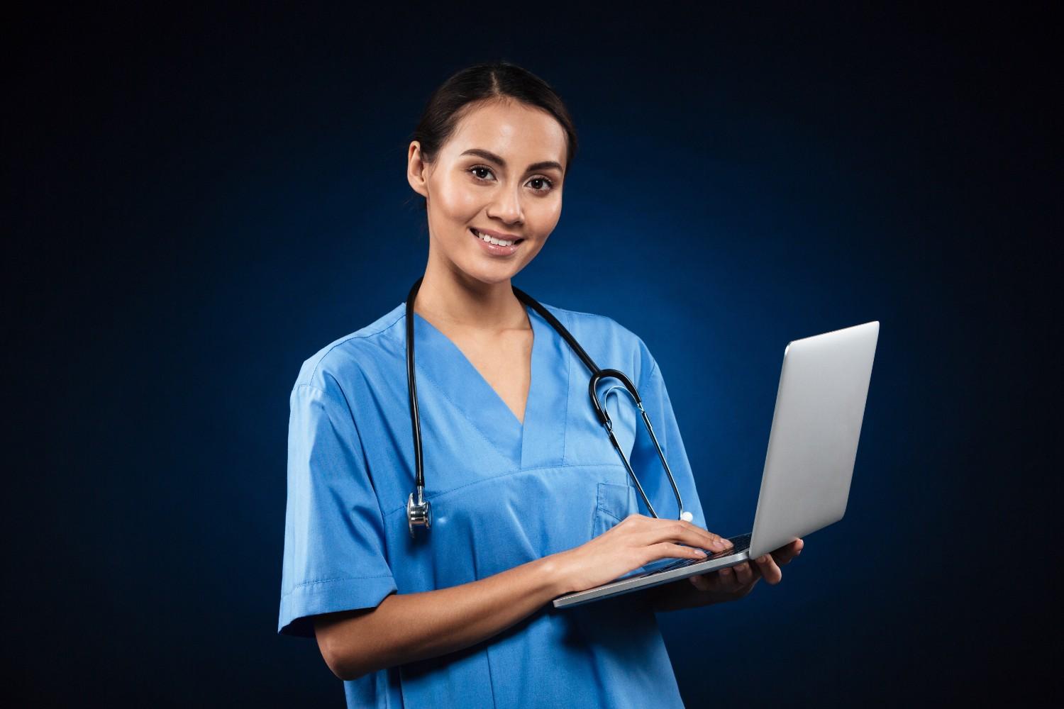 A healthcare provider discussing Virtual Medical Assistant benefits while reviewing a tablet.