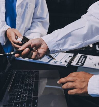 A medical coder reviewing patient files for accurate coding.