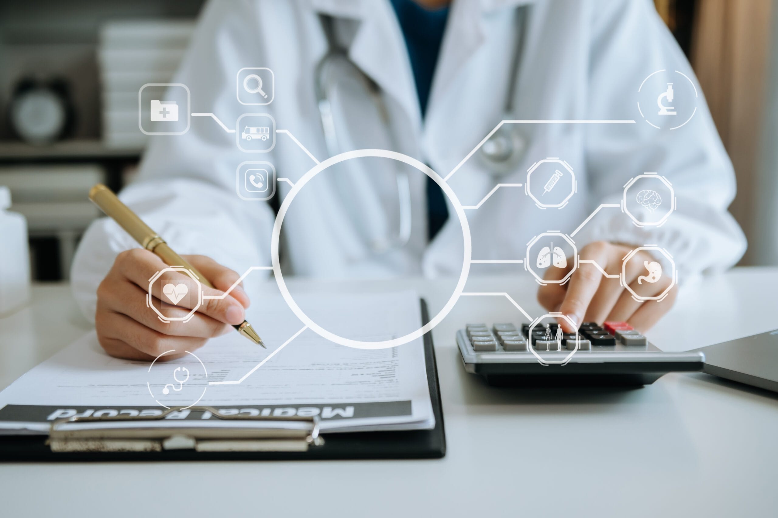 Healthcare worker analyzing medical coding data on a laptop screen with charts and claim forms visible.