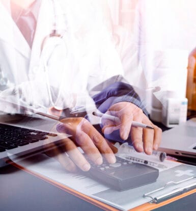 Medical scribe working alongside a doctor in a healthcare setting.