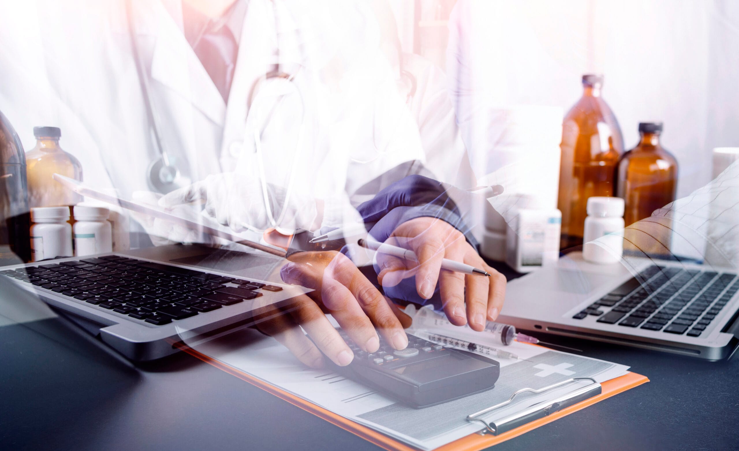 Medical scribe working alongside a doctor in a healthcare setting.