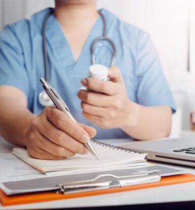 Doctor working with a medical scribe.