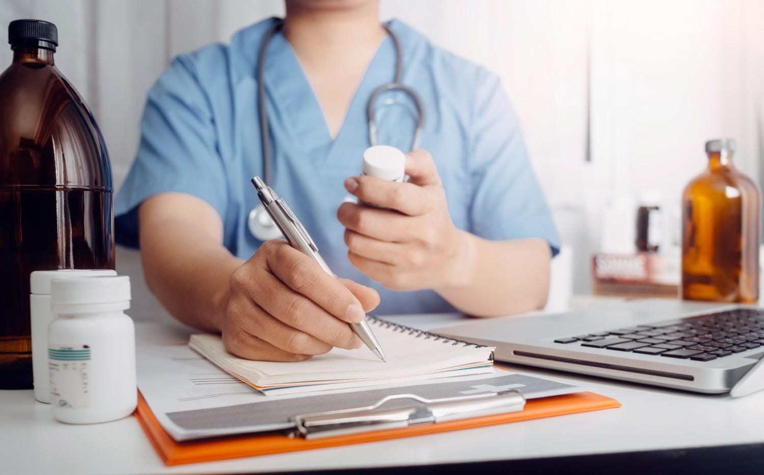 Doctor working with a medical scribe.