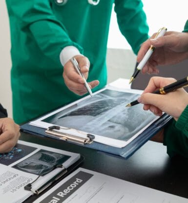 Medical coder analyzing charts in a rural clinic