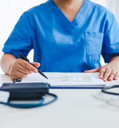 A healthcare provider working with a virtual scribe in real-time