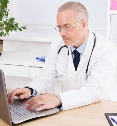 A virtual scribe using EHR software during a telehealth session.