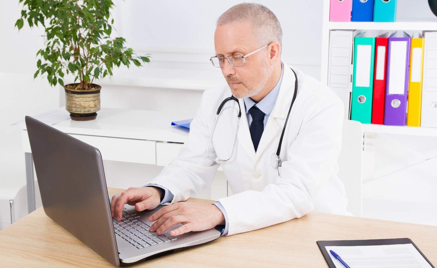 A virtual scribe using EHR software during a telehealth session.