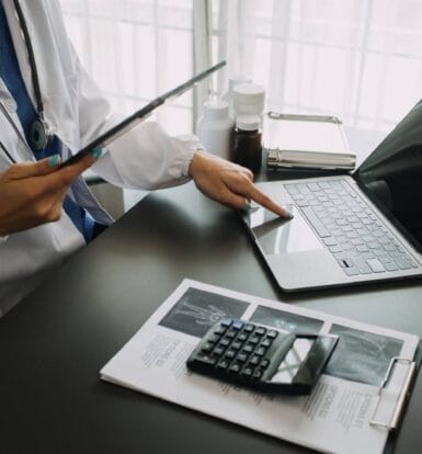 Medical coder reviewing electronic health records