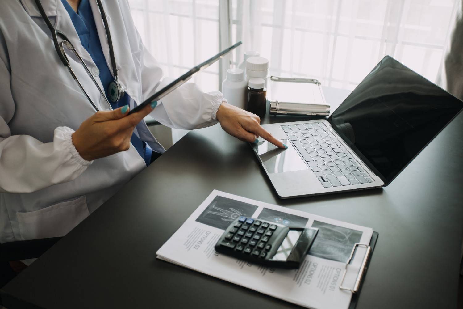 Medical coder reviewing electronic health records