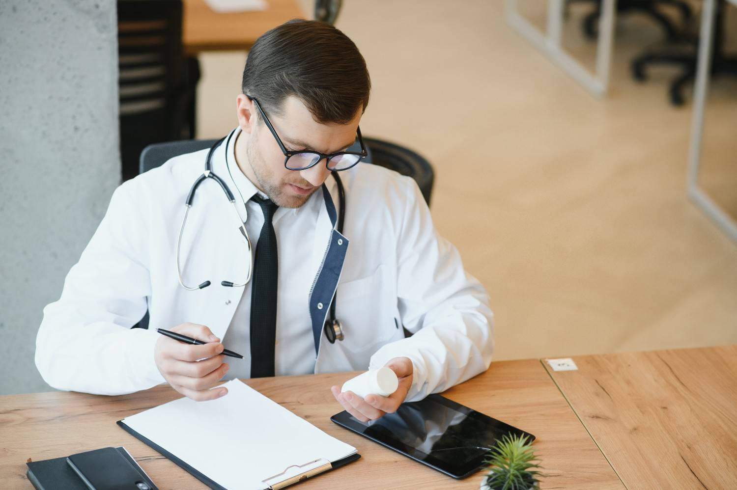 A remote medical scribe documenting a telemedicine session in real time.