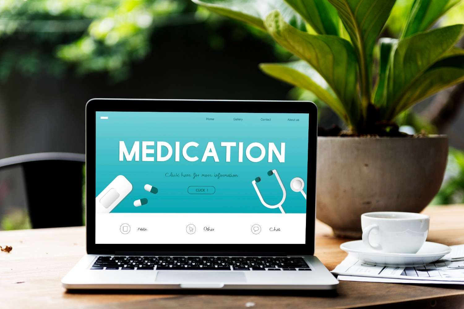 Medication website on a laptop screen, showcasing healthcare services with a stethoscope and pills in the design.