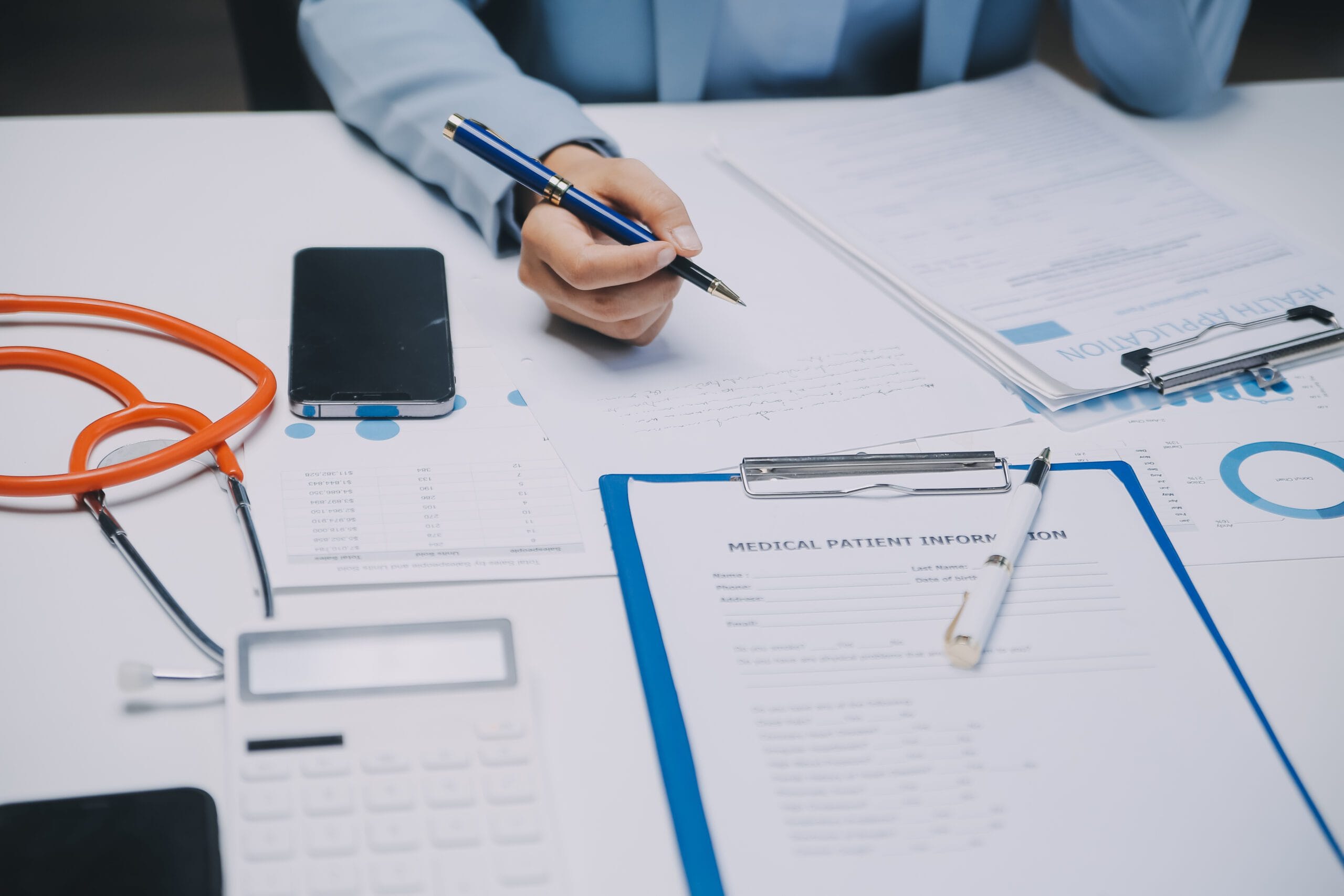 Healthcare professional verifying patient insurance eligibility on a computer