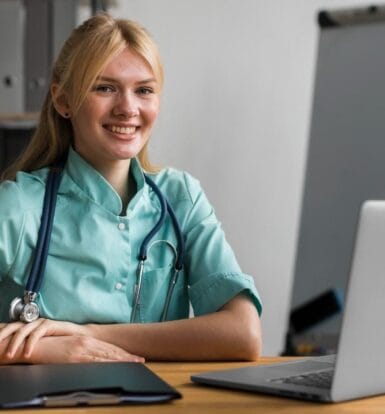 Smiling virtual medical assistant sitting at a desk with a laptop and clipboard, ready to assist telemedicine operations.