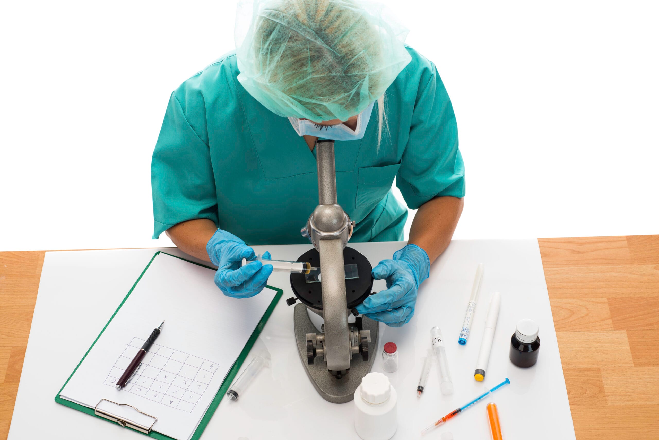 A healthcare provider consulting with a patient using telemedicine while a medical scribe documents notes.