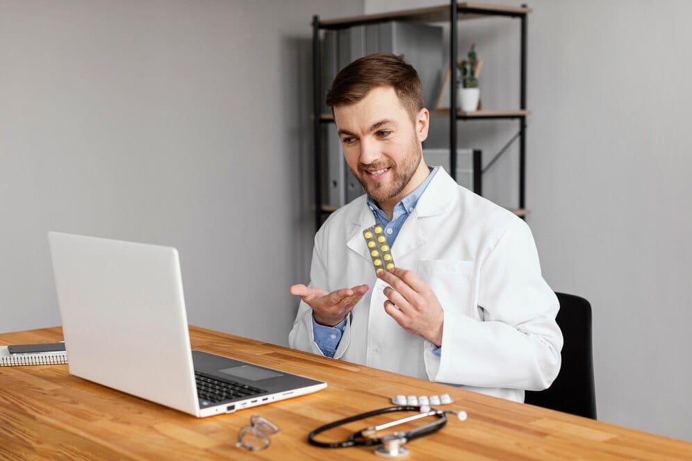 Healthcare professional reviewing billing documents with a consultant.