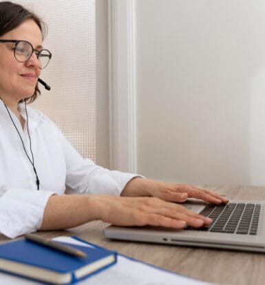 Virtual medical assistant working remotely on a laptop while assisting a healthcare practice with administrative tasks.