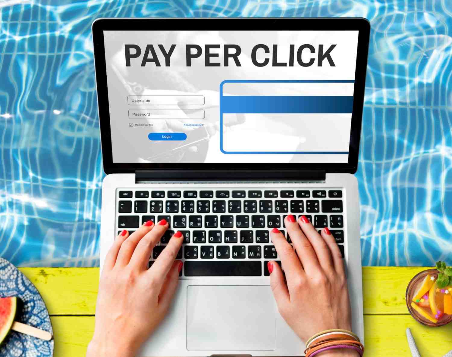 Hands typing on a laptop with a PPC advertising login screen displayed.