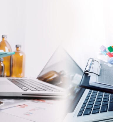 A pharmacist reviewing billing data on a computer with automated software.