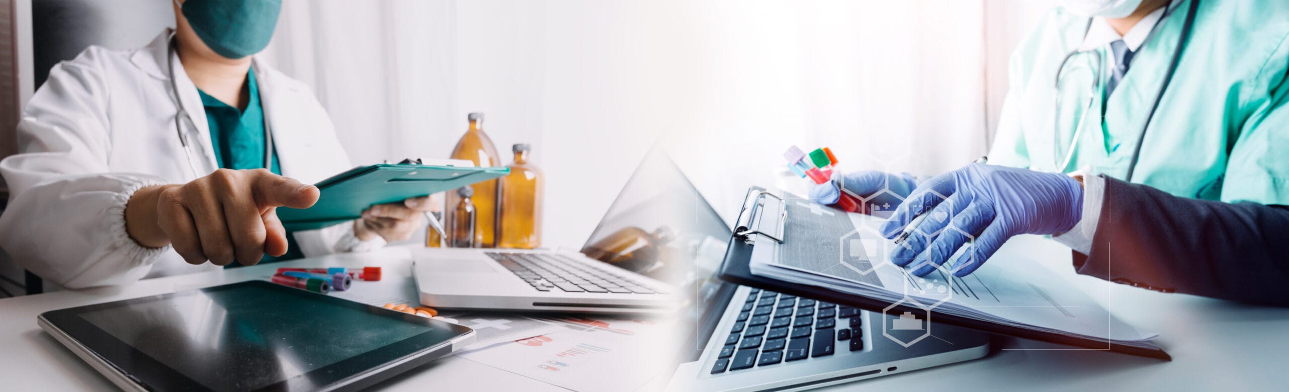 A pharmacist reviewing billing data on a computer with automated software.