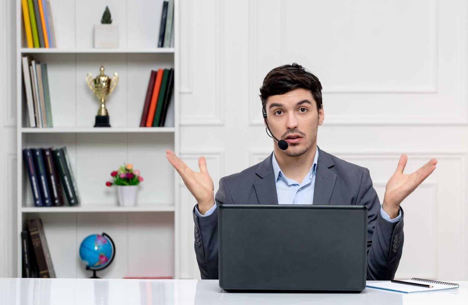 Man with a headset providing virtual support, representing virtual healthcare staff services like prior authorization assistance.