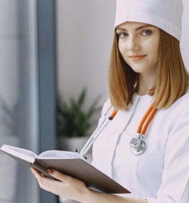 Female doctor holding a notebook, symbolizing efficient healthcare workflows supported by Virtual Telemedicine Services.