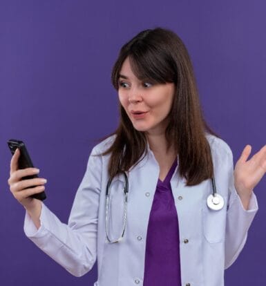 Female healthcare provider surprised while using a voice-activated device, showcasing the impact of voice search in healthcare.