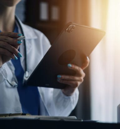 A pharmacist reviewing billing statements in an LTC pharmacy