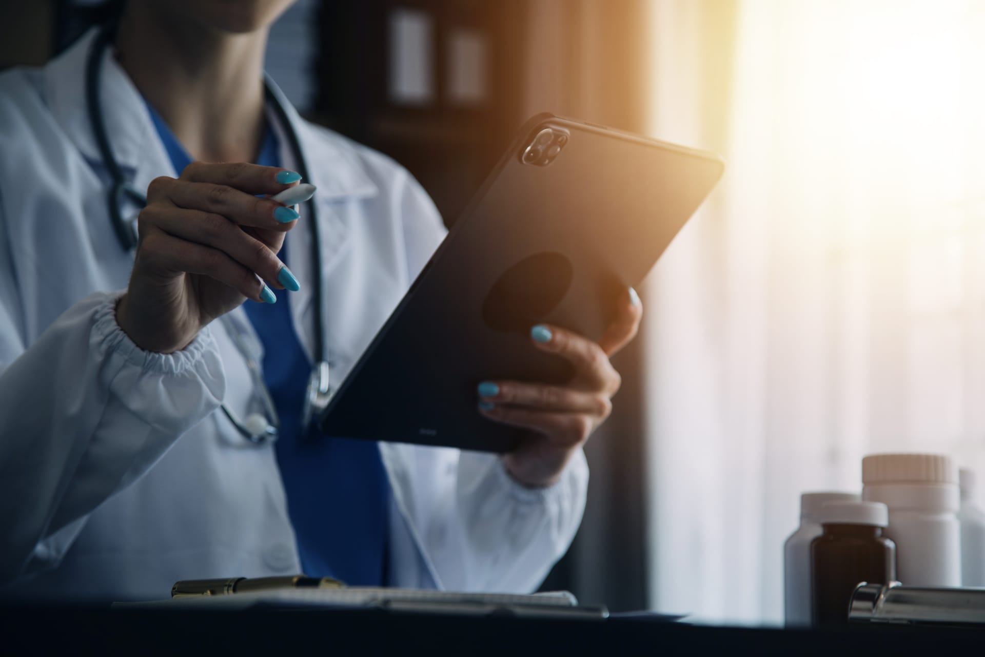 A pharmacist reviewing billing statements in an LTC pharmacy