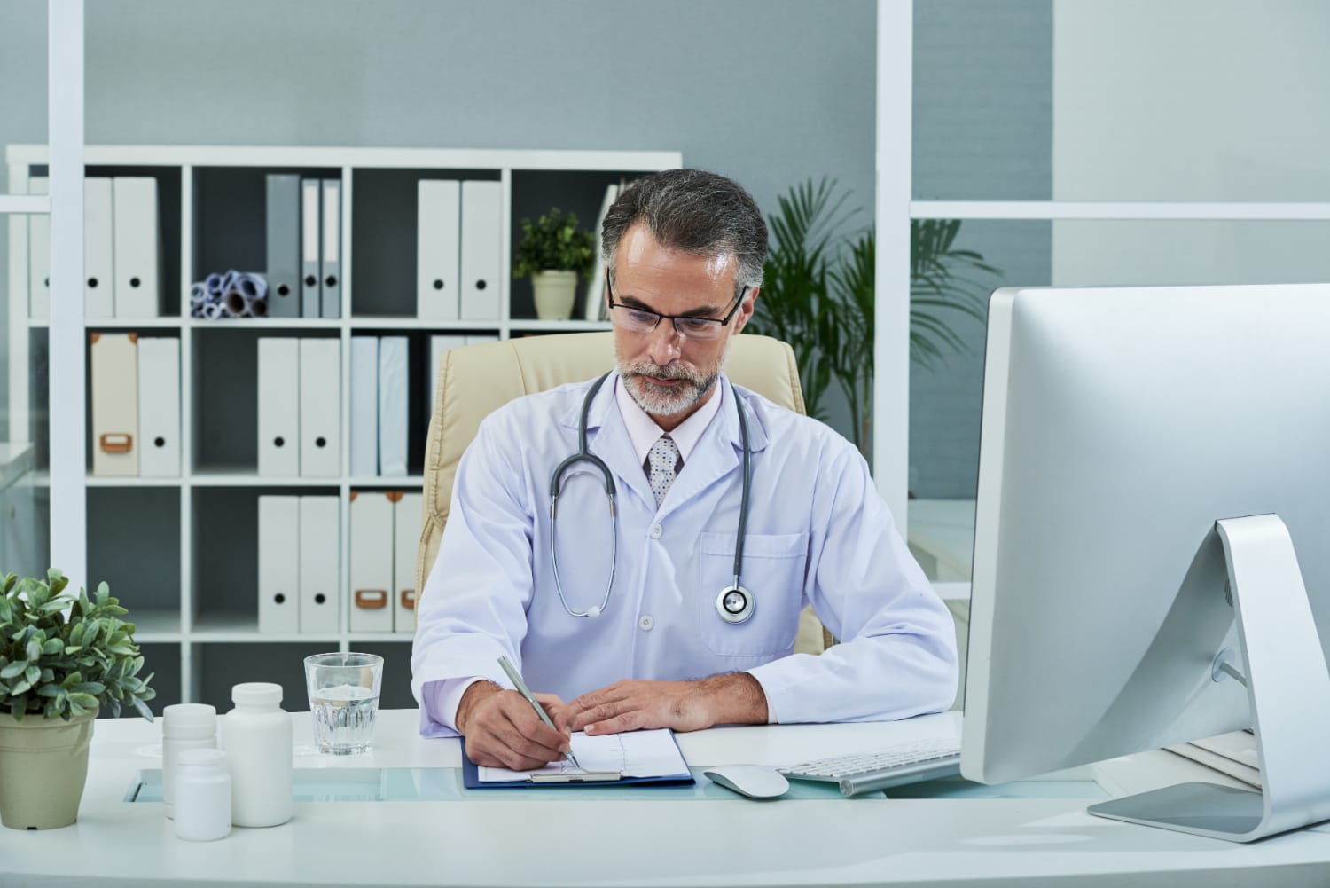 A pharmacist discussing billing solutions with an outsourcing expert.