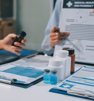 Doctor reviewing a patient’s medication list to expedite prior authorization in New York City