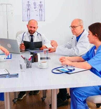 A medical coder and scribe collaborating in a New York clinic.