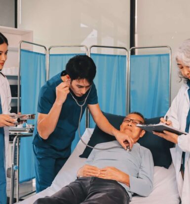 A healthcare professional reviewing medical codes on a computer.