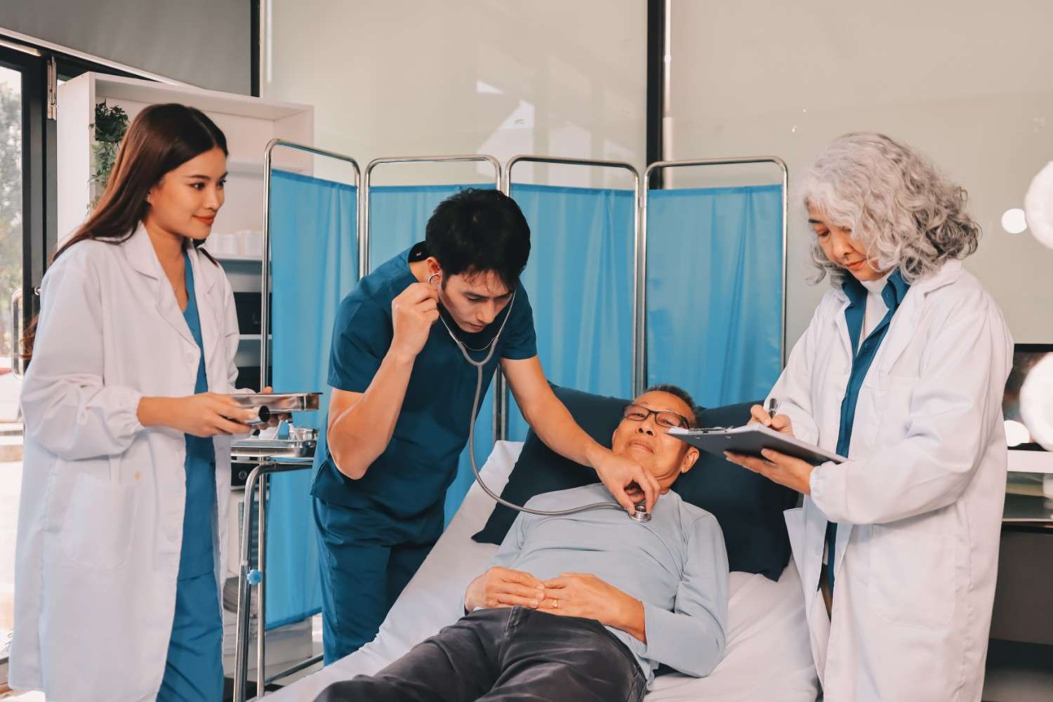 A healthcare professional reviewing medical codes on a computer.